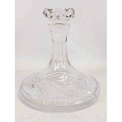 679 - A 5 piece drinks set including a crystal ships decanter with 4 crystal brandy glasses.