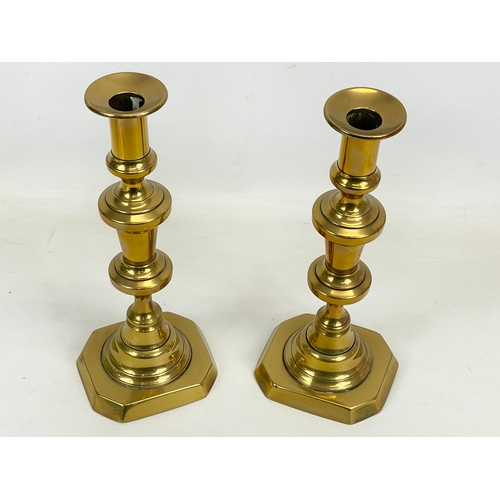 682 - A pair of Victorian brass candlesticks. 26.5cm