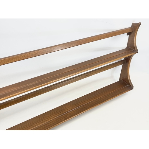 186 - An Ercol Golden Dawn Mid Century elm plate rack. 96.5cm