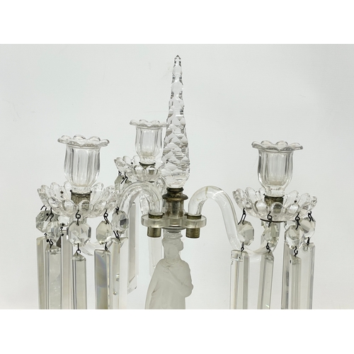 646 - A large Victorian glass candelabra with frosted glass figure on mirrored base. 29 x 45cm