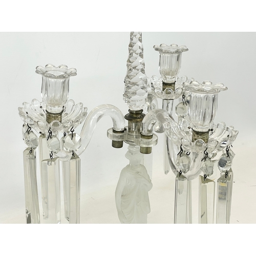 646 - A large Victorian glass candelabra with frosted glass figure on mirrored base. 29 x 45cm