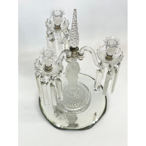 646 - A large Victorian glass candelabra with frosted glass figure on mirrored base. 29 x 45cm