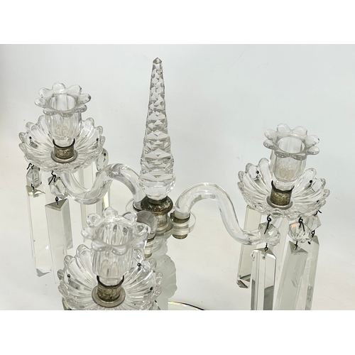 646 - A large Victorian glass candelabra with frosted glass figure on mirrored base. 29 x 45cm