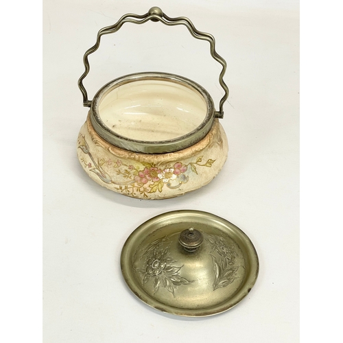 695 - A late 19th / early 20th century Royal Bonn red stamp pottery biscuit barrel, with silver plated lid... 