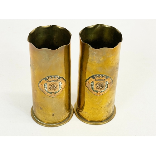 696 - A pair of small Trench Art vases. 10cm