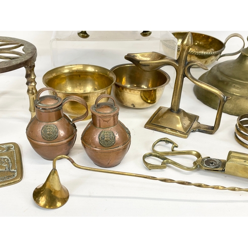 697 - A quantity of brassware. Including a Victorian trivet stand, a Victorian kettle, a Chinese brass gon... 