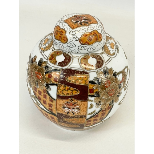 710 - A Chinese pottery ginger jar with lid. 18 x 21cm