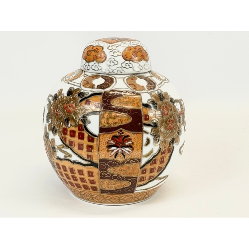 710 - A Chinese pottery ginger jar with lid. 18 x 21cm