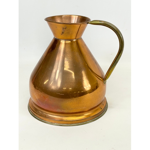 207 - A vintage brass coal bucket and a large Victorian style copper jug. Bucket measures 38.5 x 29 x 34cm