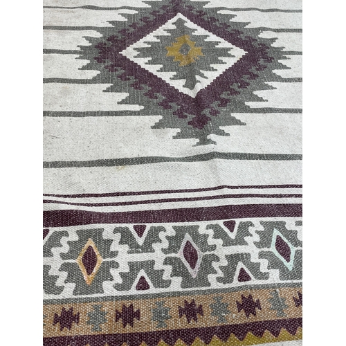 209 - A Middle Eastern style rug. 112 x 178cm