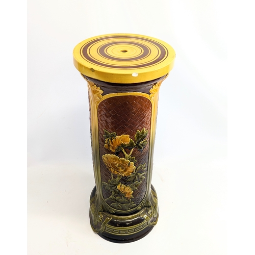 718 - A very large late Victorian English Majolica pottery jardiniere on stand. Jardiniere measures 44x31c... 