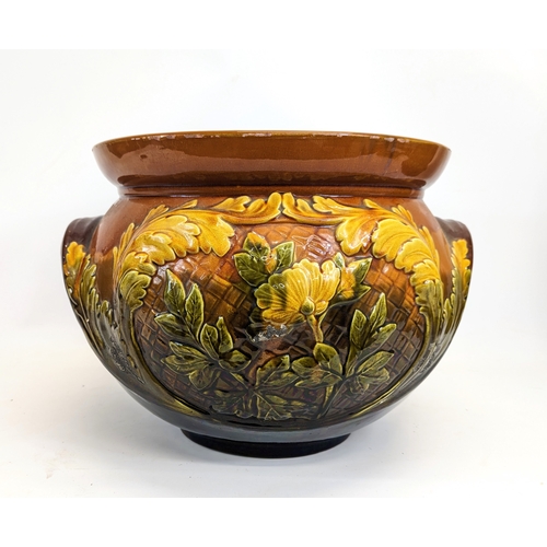 718 - A very large late Victorian English Majolica pottery jardiniere on stand. Jardiniere measures 44x31c... 