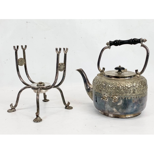 719 - A late Victorian silver plated spirit kettle. 33cm