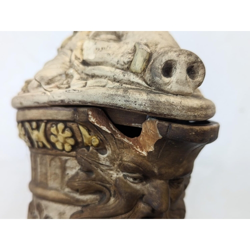 725 - A pair of large ornate 19th century pottery jugs, with Medieval figures. Tallest is 34cm