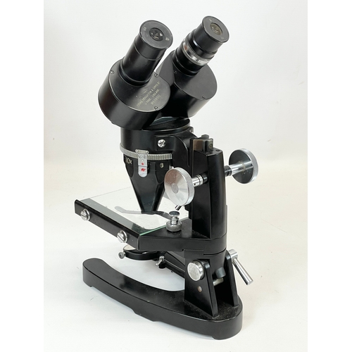 226 - A microscope in wooden case, by Cooke Throughton & Simms LTD. M604512. Case measures 25 x 26 x 40cm