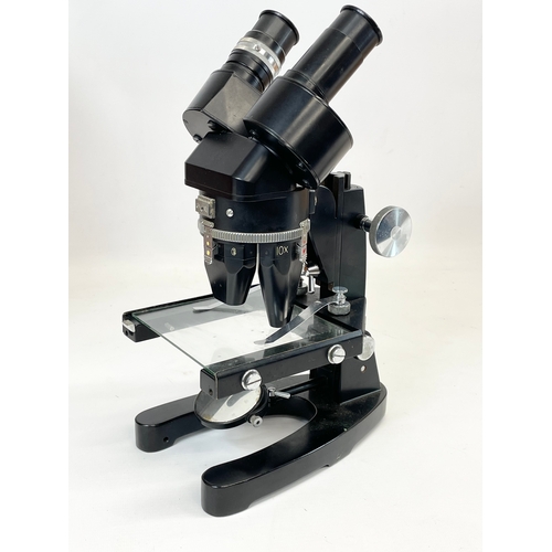 226 - A microscope in wooden case, by Cooke Throughton & Simms LTD. M604512. Case measures 25 x 26 x 40cm