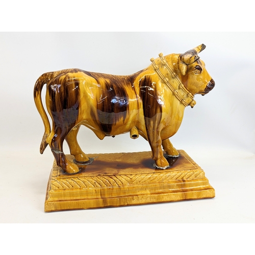 731 - A large M. Mafra pottery bull, Caldas Portugal. 39.5x18.5x35cm.