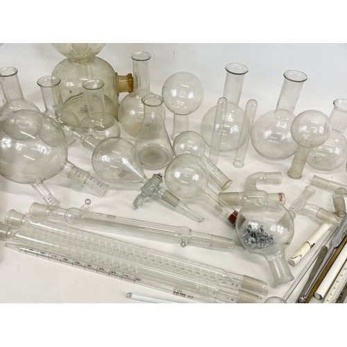 249 - A large collection of scientific and laboratory apparatus’s and Pyrex flasks.