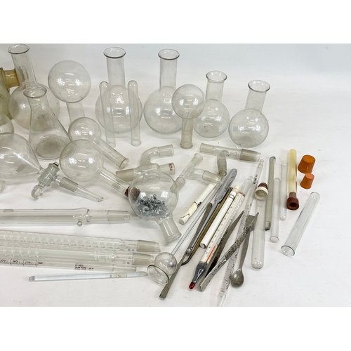 249 - A large collection of scientific and laboratory apparatus’s and Pyrex flasks.