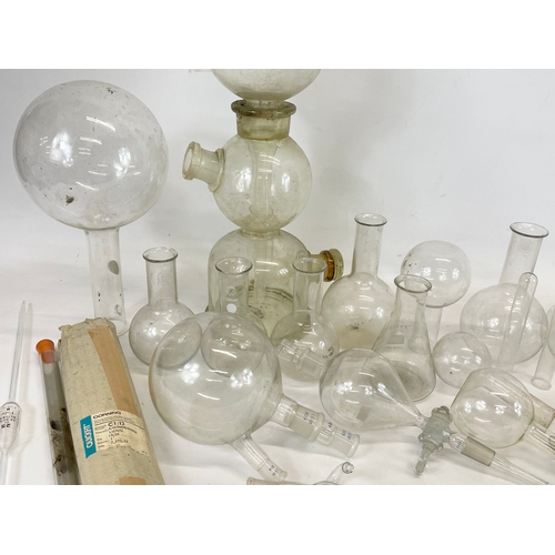 249 - A large collection of scientific and laboratory apparatus’s and Pyrex flasks.