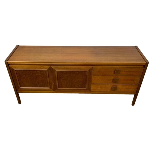 996 - A Mid Century teak sideboard. 168 x 44 x 74cm.