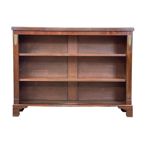 998 - A 19th century mahogany open bookcase with brass mounts and on bracket feet. 126 x 29 x 95cm