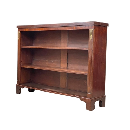 998 - A 19th century mahogany open bookcase with brass mounts and on bracket feet. 126 x 29 x 95cm