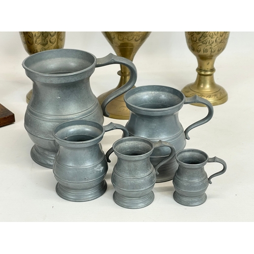 733 - A sundry lot. A Victorian gong, 3 Indian brass vases and 5 pieces of pewter. Gong measures 24 x 28cm