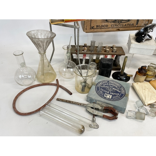 272 - A quantity of vintage chemical and laboratory equipment. Including a Dr Macaura’s Blood Circulator.