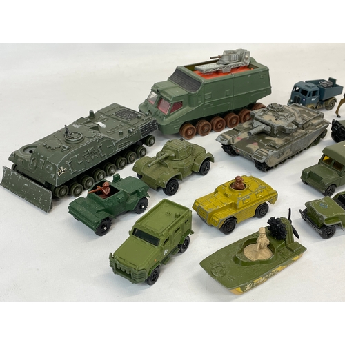 276 - A quantity of model tanks, trucks and animals etc. Dinky, Britains, Corgi.