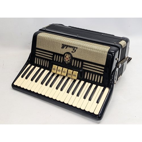 286 - A vintage Italian Scandalli accordion, supplied by Johnnie Owens, in case.