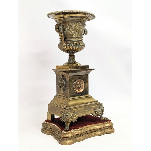 194 - A large pair of mid 19th century gilded brass garnitures on wooden stands, in the Neoclassical style... 