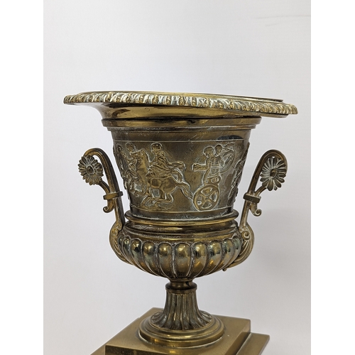 194 - A large pair of mid 19th century gilded brass garnitures on wooden stands, in the Neoclassical style... 