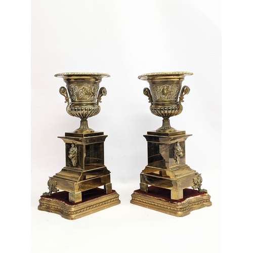 194 - A large pair of mid 19th century gilded brass garnitures on wooden stands, in the Neoclassical style... 