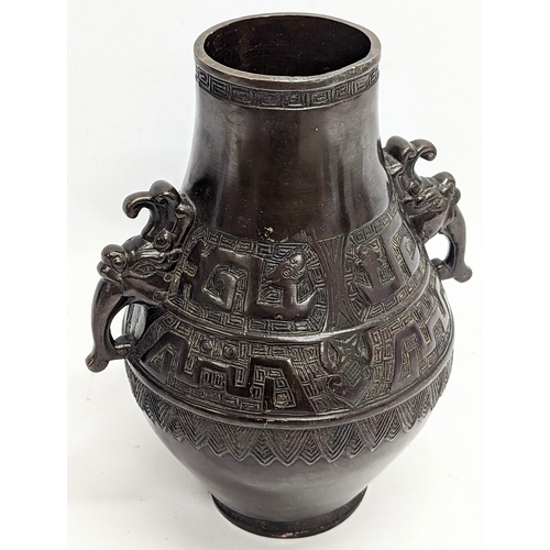 195 - A mid 19th century heavy bronze ornate vase. Qing dynasty, circa 1850. 21x26cm