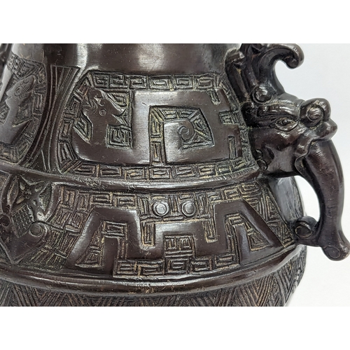 195 - A mid 19th century heavy bronze ornate vase. Qing dynasty, circa 1850. 21x26cm