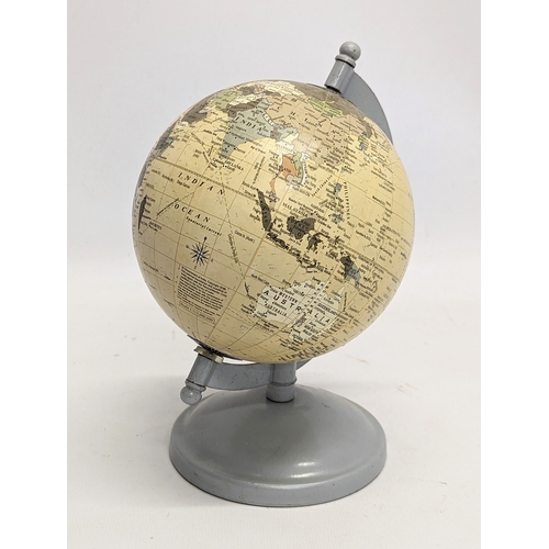 326 - A model aircraft and miniature globe.