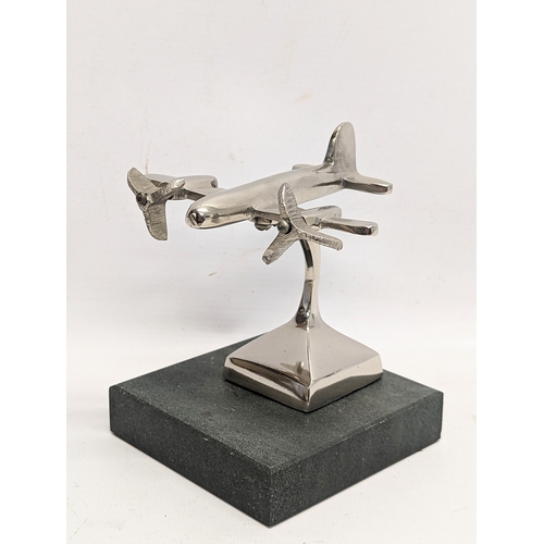 326 - A model aircraft and miniature globe.