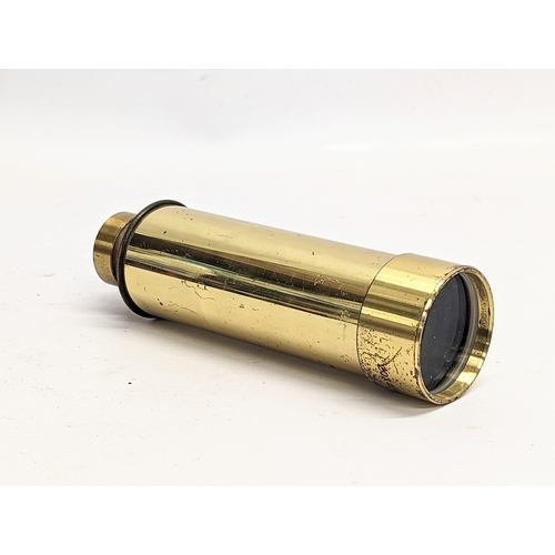 327 - A brass extendable telescope. Extended 40cm, not extended 15cm