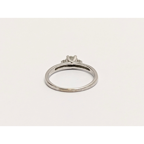 609 - An 18ct white gold, diamond 3 stone. Estimate 0.25ct centre + 0.10ct.