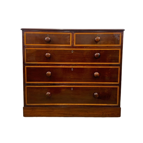 992 - A Victorian inlaid mahogany chest of drawers. 104 x 53 x 93cm.