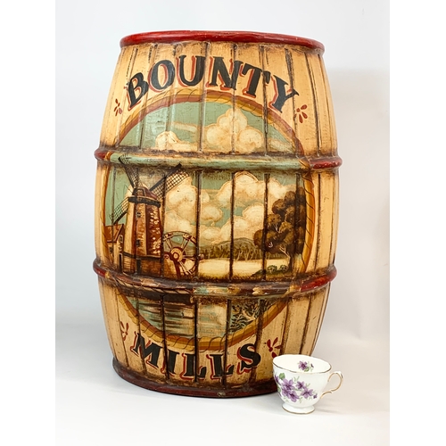 318 - A large wooden barrel shape umbrella stick stand. Bounty Mills. 39 x 55cm