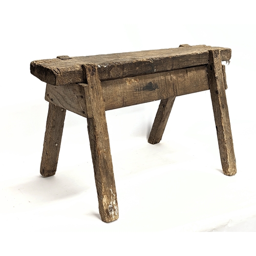 344 - An early 20th century joiners stool. 86x44x49cm