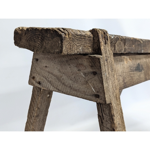 344 - An early 20th century joiners stool. 86x44x49cm