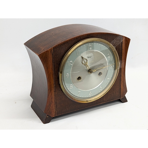 639 - A vintage Smiths mantle clock with 1 other mantle clock and oak barometer.