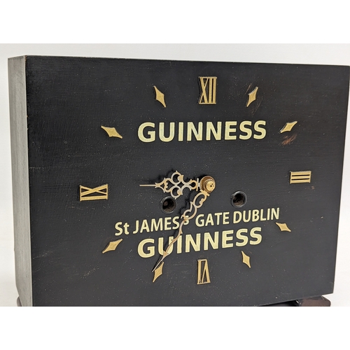 742 - A Guinness style mantle clock. 24.5x11x20.5cm