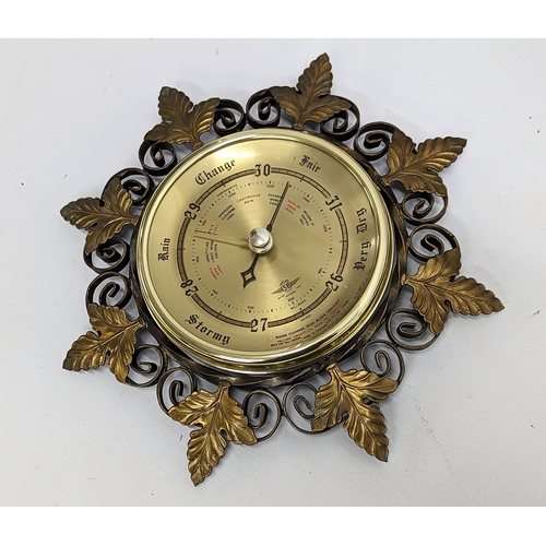 743 - A vintage barometer with brass barometer.