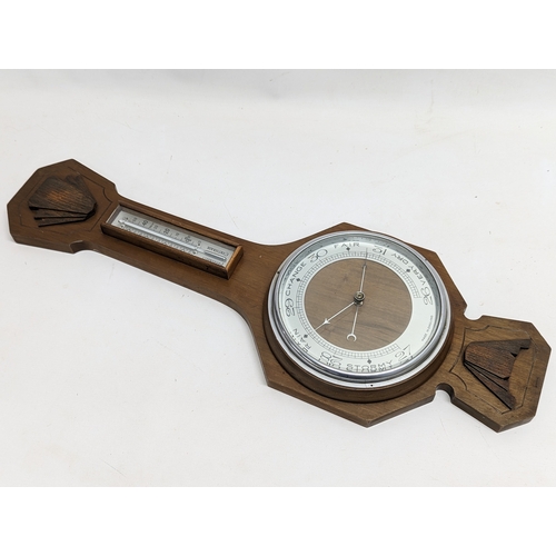 743 - A vintage barometer with brass barometer.