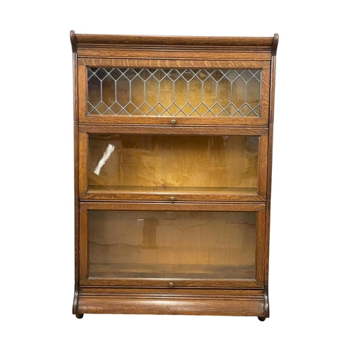 782 - An early 20th century oak stacking bookcase by Gunn. Circa 1900-20. 87 x 36 x 127cm