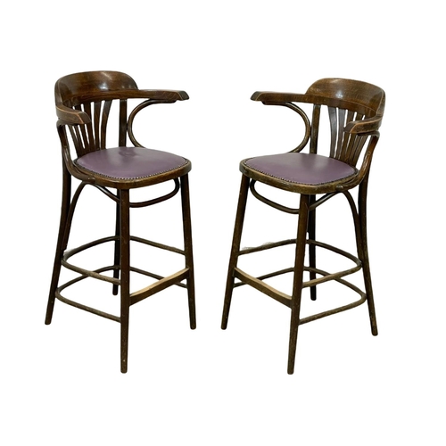 784 - A pair of vintage Bentwood high stools with vinyl seats. 95cm